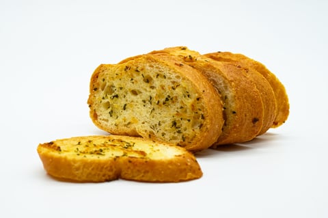 Freshly baked garlic bread with golden crispy crust